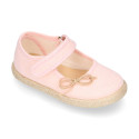 Cotton canvas little girl Mary Jane shoes with hook and loop strap and bow design.