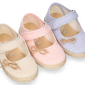 Cotton canvas little girl Mary Jane shoes with hook and loop strap and bow design.