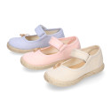 Cotton canvas little girl Mary Jane shoes with hook and loop strap and bow design.