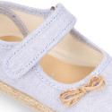 Cotton canvas little girl Mary Jane shoes with hook and loop strap and bow design.