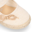 Cotton canvas little girl Mary Jane shoes with hook and loop strap and bow design.