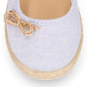 Cotton canvas little girl Mary Jane shoes with hook and loop strap and bow design.