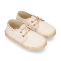 Kids laces up shoes espadrille style in cotton canvas to dress.