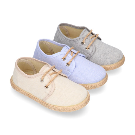 Kids laces up shoes espadrille style in cotton canvas to dress.