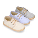 Kids laces up shoes espadrille style in cotton canvas to dress.