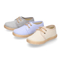 Kids laces up shoes espadrille style in cotton canvas to dress.