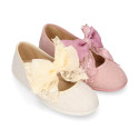 Linen Girl Mary Jane shoes with hook and loop strap closure with bow with lace design.