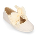 Linen Girl Mary Jane shoes with hook and loop strap closure with bow with lace design.