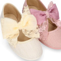 Linen Girl Mary Jane shoes with hook and loop strap closure with bow with lace design.