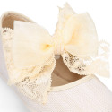 Linen Girl Mary Jane shoes with hook and loop strap closure with bow with lace design.