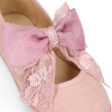 Linen Girl Mary Jane shoes with hook and loop strap closure with bow with lace design.