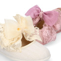 Linen Girl Mary Jane shoes with hook and loop strap closure with bow with lace design.
