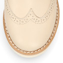 Blucher niño ceremonia con cordones en piel napa beige.