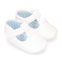 Cotton canvas T-strap shoes with hook and loop strap for babies.