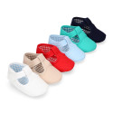 Cotton canvas T-strap shoes with hook and loop strap for babies.