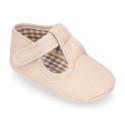 Cotton canvas T-strap shoes with hook and loop strap for babies.