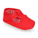 Cotton canvas T-strap shoes with hook and loop strap for babies.