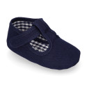 Cotton canvas T-strap shoes with hook and loop strap for babies.