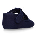 Cotton canvas T-strap shoes with hook and loop strap for babies.