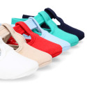 Cotton canvas T-strap shoes with hook and loop strap for babies.