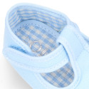 Cotton canvas T-strap shoes with hook and loop strap for babies.