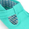 Cotton canvas T-strap shoes with hook and loop strap for babies.