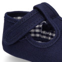 Cotton canvas T-strap shoes with hook and loop strap for babies.
