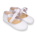 Laminated canvas girl Mary Jane shoes with ribbon closure.