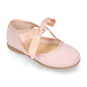 Laminated canvas girl Mary Jane shoes with ribbon closure.