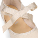 Laminated canvas girl Mary Jane shoes with ribbon closure.