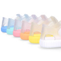 Tennis style kids jelly shoes with hook and loop strap and soles in colors.