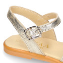 Leather Girl Sandal shoes with h shape design in gold color.