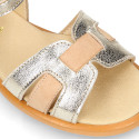 Leather Girl Sandal shoes with h shape design in gold color.