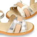 Leather Girl Sandal shoes with h shape design in gold color.