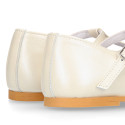Little T-Strap Okaa Mary Jane shoes in extra soft pearl ivory Nappa leather with perforated design.