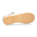 Little T-Strap Okaa Mary Jane shoes in extra soft pearl ivory Nappa leather with perforated design.