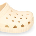 Kids jelly shoes with clog strap design in ivory color for beach and pool use.