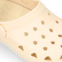 Kids jelly shoes with clog strap design in ivory color for beach and pool use.