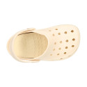 Kids jelly shoes with clog strap design in ivory color for beach and pool use.