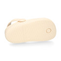 Kids jelly shoes with clog strap design in ivory color for beach and pool use.