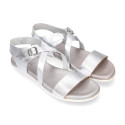 Metal finish leather sandal with anatomical white soles.