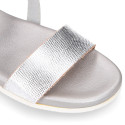 Metal finish leather sandal with anatomical white soles.