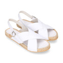 Leather sandal shoes espadrille style with crossed straps.