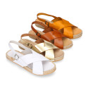 Leather sandal shoes espadrille style with crossed straps.