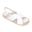 Leather sandal shoes espadrille style with crossed straps.