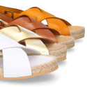 Leather sandal shoes espadrille style with crossed straps.