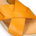 Leather sandal shoes espadrille style with crossed straps.