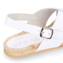 Leather sandal shoes espadrille style with crossed straps.