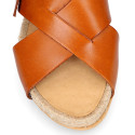 Leather sandal shoes espadrille style with crossed straps.