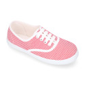 Cotton stripe canvas bamba type shoes with shoelaces.